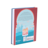 Book with a red cover and blue back featuring a cityscape illustration.