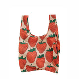 Baggu Reusable bag with strawberry pattern on a beige background