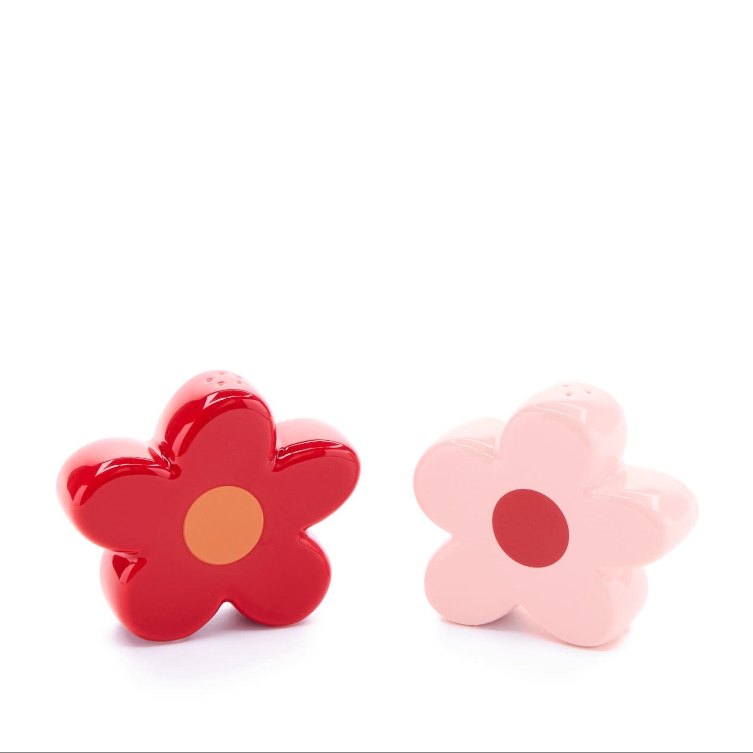 pink and red daisy salt and pepper shakers in on a white background.
