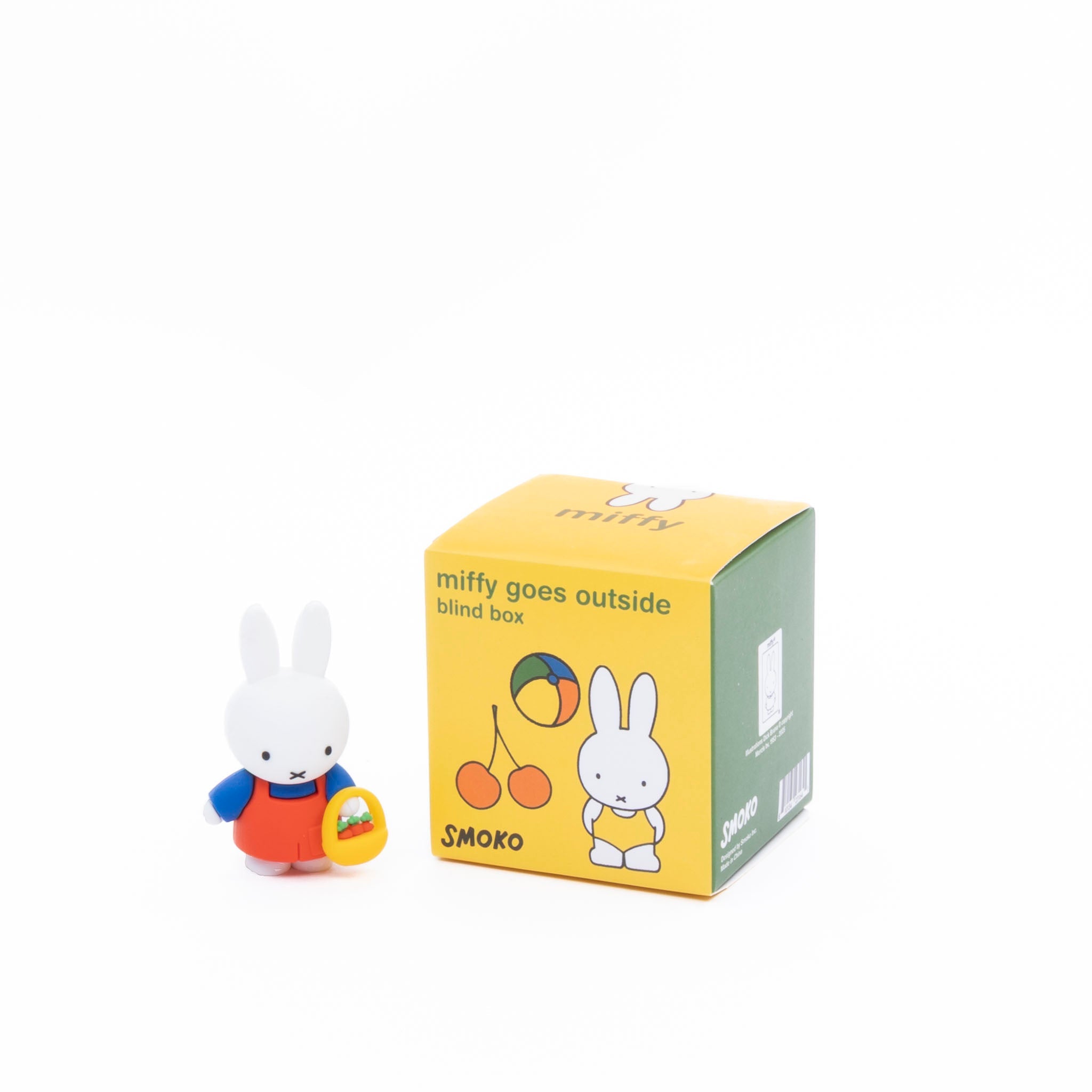 Miffy figurine with a yellow blind box packaging on a white background